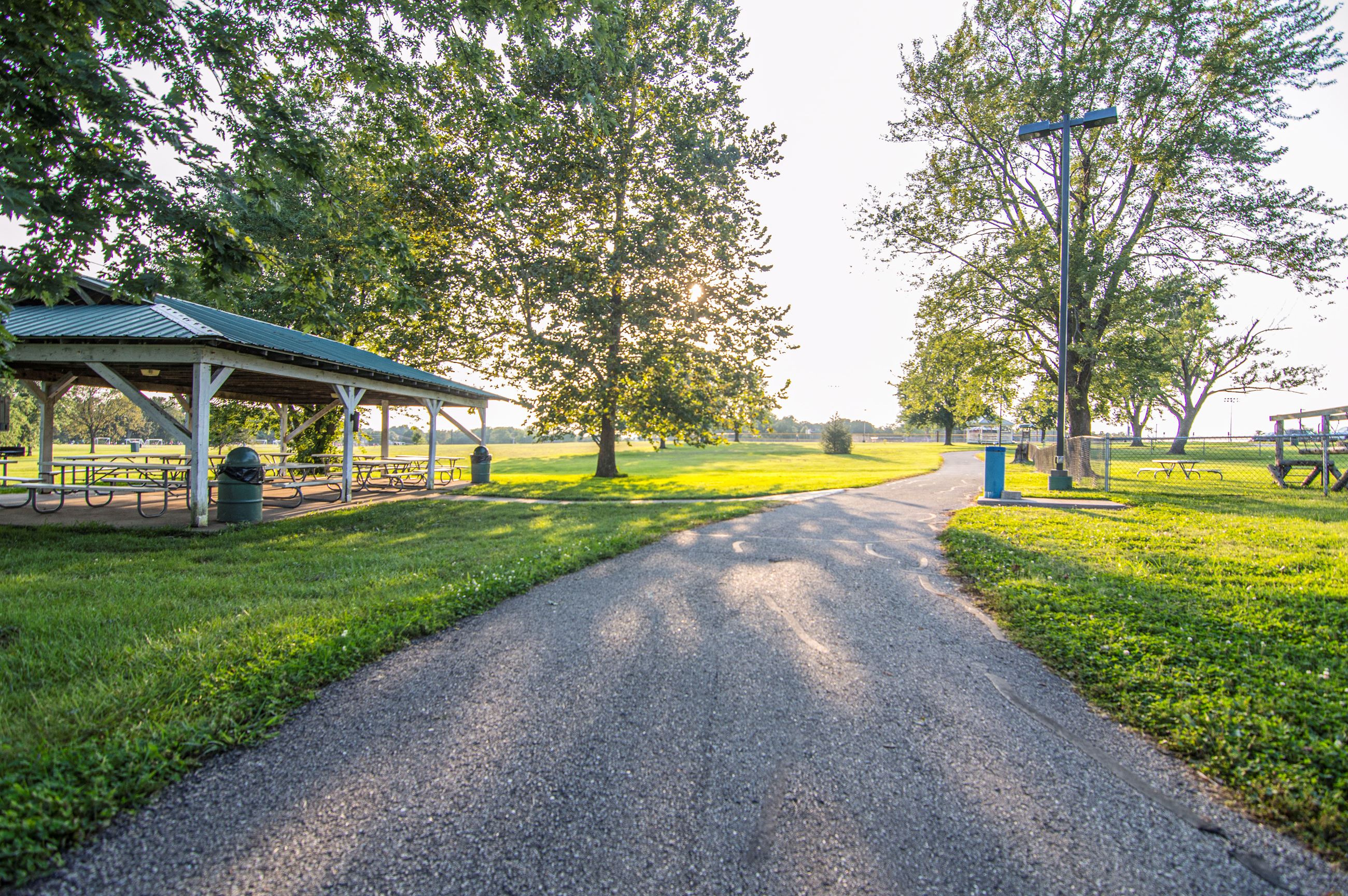 Wide view of Atchley Park in Lebanon, Missouri, featuring ball fields, walking trail, and surroundin